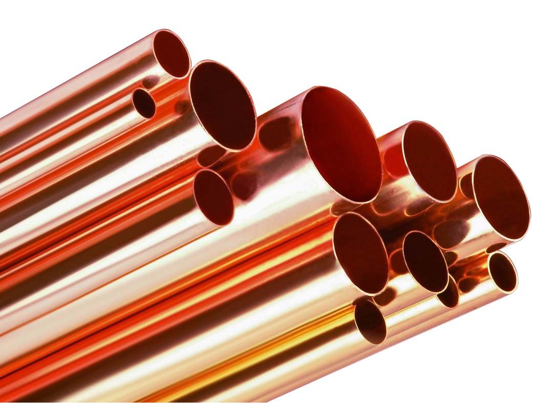 Bundle of shiny copper pipes of different sizes for houses